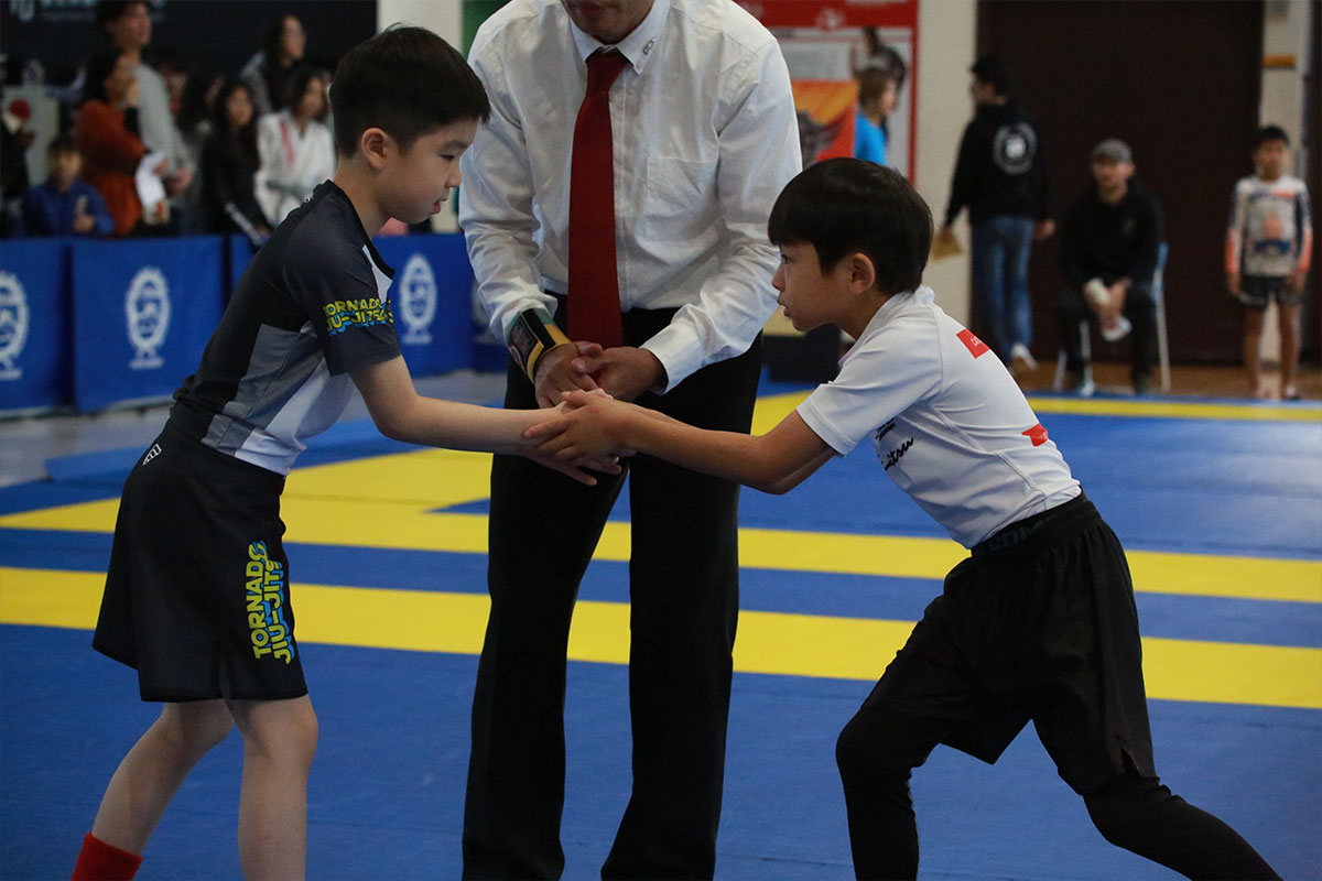 Junior BJJ class — athletes centering before training at Catch Jiu Jitsu Kaohsiung