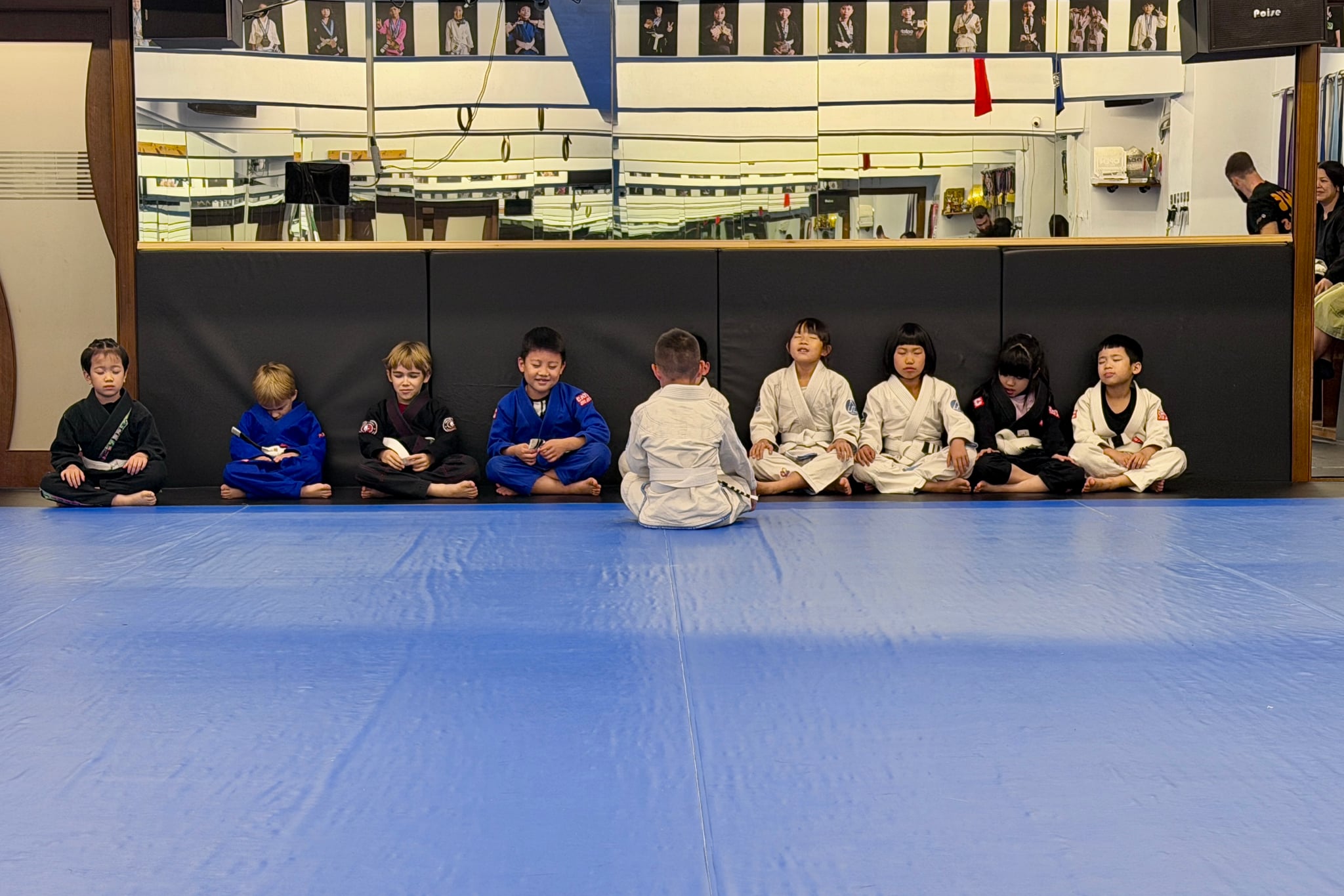 Youth BJJ class — children sitting quietly and focusing before training at Catch Jiu Jitsu Kaohsiung